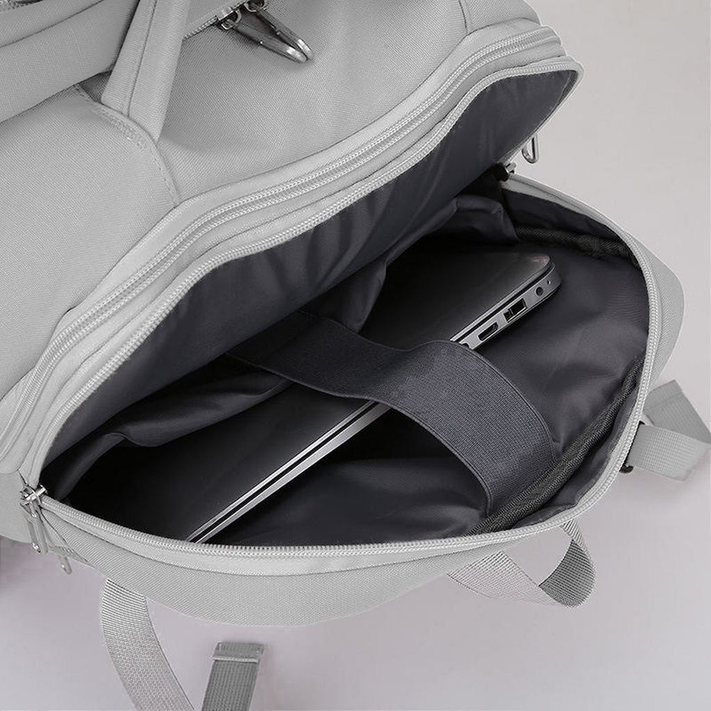 TAKT 20 under-seat cabin backpack in Grey, padded laptop sleeve with a laptop in place